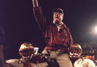 1 Jan 1996:  Head coach Bobby Bowden of the Florida State Seminoles is carried triumphantly off the field by nose guard Andre Wadsworth #8 and tackle Orpheus Roy after defeating the Notre Dame Fighting Irish in the Orange Bowl in Miami, Florida 31-26.  Ma