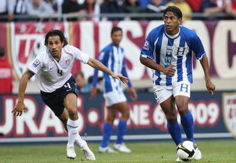 CHICAGO - JUNE 06: Carlos Costly #13 of Honduras controls the ball as Pablo Mastroeni #4 of the United States defends during a FIFA 2010 World Cup Qualifying match on June 6, 2009 at Soldier Field in Chicago, Illinois. The United States defeated Honduras 2-1. (Photo by Jonathan Daniel/Getty Images)