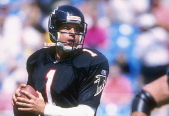Quarterback Jeff George of the Atlanta Falcons carries the football during the Falcons 29-6 loss to the Carolina Panthers at Ericsson Stadium in Charlotte, North Carolina. The game was the inaugural game in the Panthers Ericsson Stadium.