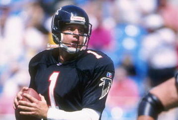 Quarterback Jeff George of the Atlanta Falcons carries the football during the Falcons 29-6 loss to the Carolina Panthers at Ericsson Stadium in Charlotte, North Carolina. The game was the inaugural game in the Panthers Ericsson Stadium.