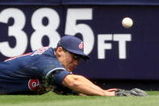 NEW YORK - APRIL 19:  Grady Sizemore #24 of the Cleveland Indians dives for a ball hit by Derek Jeter #2 of the New York Yankees at Yankee Stadium on April 19, 2009 in the Bronx borough of New York City.  (Photo by Ezra Shaw/Getty Images)