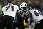 NASHVILLE, TN - JANUARY 10:  (M) Defensive tackle Albert Haynesworth #93 of the Tennessee Titans is double-teammed by lineman Jared Gaither #71 and Ben Grubbs #66 of the Baltimore Ravens during the AFC Divisional Playoff Game on January 10, 2009 at LP Field in Nashville, Tennessee.  (Photo by Jonathan Daniel/Getty Images)