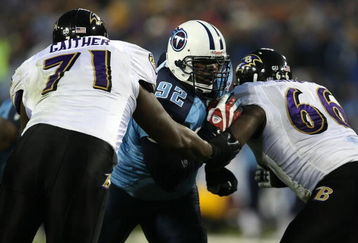 NASHVILLE, TN - JANUARY 10:  (M) Defensive tackle Albert Haynesworth #93 of the Tennessee Titans is double-teammed by lineman Jared Gaither #71 and Ben Grubbs #66 of the Baltimore Ravens during the AFC Divisional Playoff Game on January 10, 2009 at LP Field in Nashville, Tennessee.  (Photo by Jonathan Daniel/Getty Images)