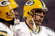 MINNEAPOLIS - OCTOBER 05:  Quarterback Aaron Rodgers #12 of the Green Bay Packers walks off the field during the Monday Night Football game against the Minnesota Vikings on October 5, 2009 at Hubert H. Humphrey Metrodome in Minneapolis, Minnesota.  (Photo by Jamie Squire/Getty Images)
