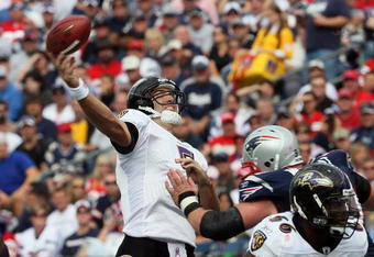 FOXBORO, MA - OCTOBER 4:  Joe Flacco #5 of the Baltimore Ravens throws toward the end zone in the first half at Gillette Stadium on October 4, 2009 in Foxboro, Massachusetts. (Photo by Jim Rogash/Getty Images)