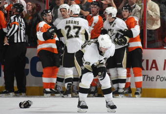 PHILADELPHIA - OCTOBER 08: Kris Letang #58 of the Pittsburgh Penguins leaves the ice after being injured in a third period skirmish against the Philadelphia Flyers at the Wachovia Center on October 8, 2009 in Philadelphia, Pennsylvania. The Penguins defetaed the Flyers 5-4. (Photo by Bruce Bennett/Getty Images)