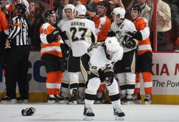 PHILADELPHIA - OCTOBER 08: Kris Letang #58 of the Pittsburgh Penguins leaves the ice after being injured in a third period skirmish against the Philadelphia Flyers at the Wachovia Center on October 8, 2009 in Philadelphia, Pennsylvania. The Penguins defetaed the Flyers 5-4. (Photo by Bruce Bennett/Getty Images)