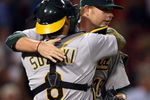 BOSTON - JULY 06:  Starting pitcher Brett Anderson #49 of the Oakland Athletics is congratulated by Kurt Suzuki #8 after his shutout against the Boston Red Sox on July 6, 2009 at Fenway Park in Boston, Massachusetts. The Athletics defeated the Red Sox 6-0.  (Photo by Elsa/Getty Images)