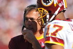 LANDOVER, MD - OCTOBER 4:  Head coach Jim Zorn speaks with Jason Campbell #17 of the Washington Redskins during a time out against the Tampa Bay Buccaneers at FedExField on October 4, 2009 in Landover, Maryland. The Redskins defeated the Buccaneers 16-13. (Photo by Larry French/Getty Images)