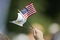 UNITED STATES - SEPTEMBER 22:  A fan waves U.S. and Presidents Cup flags during the opening ceremony of The Presidents Cup at Robert Trent Jones Golf Club in Prince William County, Virginia on September 22, 2005.  (Photo by Hunter Martin/Getty Images)