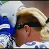 25 Oct 1987: Linebacker Brian Bosworth of the Seattle Seahawks takes off his helmet during a game against the Los Angeles Raiders at the Los Angeles Memorial Coliseum in Los Angeles, California. The Seahawks won the game, 35-13.