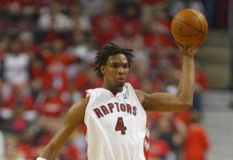 TORONTO, ON - APRIL 26:  Chris Bosh #4 of the Toronto Raptors picks up a rebound against the Orlando Magic in Game Four of the Eastern Conference Quarterfinals at the Air Canada Centre April 26, 2008 in Toronto, Ontario. The Magic defeated the Raptors 106-94 to take a 3-1 series lead.  (Photo by Claus Andersen/Getty Images)