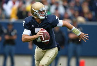 SOUTH BEND, IN - OCTOBER 03: Jimmy Clausen #7 of the Notre Dame Fighting Irish looks for a receiver against the Washington Huskies on October 3, 2009 at Notre Dame Stadium in South Bend, Indiana. Notre Dame defeated Washington 37-30 in overtime. (Photo by Jonathan Daniel/Getty Images)