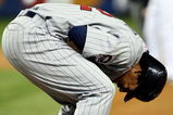 NEW YORK - OCTOBER 09:  Carlos Gomez #22 of the Minnesota Twins reacts after getting hit on the hand by a pitch against the New York Yankees in Game Two of the ALDS during the 2009 MLB Playoffs at Yankee Stadium on October 9, 2009 in the Bronx borough of New York City.  (Photo by Nick Laham/Getty Images)