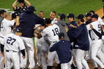 NEW YORK - OCTOBER 09:  The New York Yankees celebrate a walk off home run in the eleventh inning by Mark Teixeira #25 against the Minnesota Twins in Game Two of the ALDS during the 2009 MLB Playoffs at Yankee Stadium on October 9, 2009 in the Bronx borough of New York City.  (Photo by Jared Wickerham/Getty Images)