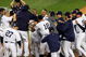 NEW YORK - OCTOBER 09:  The New York Yankees celebrate a walk off home run in the eleventh inning by Mark Teixeira #25 against the Minnesota Twins in Game Two of the ALDS during the 2009 MLB Playoffs at Yankee Stadium on October 9, 2009 in the Bronx borough of New York City.  (Photo by Jared Wickerham/Getty Images)