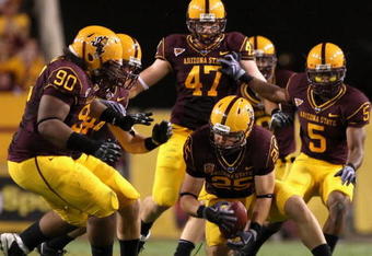 TEMPE, AZ - SEPTEMBER 19:  Linebacker Mike Nixon #25 of the Arizona State Sun Devils recovers a fumble from the Louisiana Monroe Warhawks during the third quarter of the college football game at Sun Devil Stadium on September 19, 2008 in Tempe, Arizona. The Sun Devils defeated the Warhawks 38-14.  (Photo by Christian Petersen/Getty Images)
