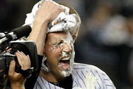NEW YORK - OCTOBER 09:  Mark Teixeira #25 of the New York Yankees gets a pie in the face by teammate A.J. Burnett #34 after hitting a walk off home run in the eleventh inning against the Minnesota Twins in Game Two of the ALDS during the 2009 MLB Playoffs at Yankee Stadium on October 9, 2009 in the Bronx borough of New York City.  (Photo by Nick Laham/Getty Images)