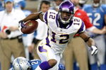 DETROIT - SEPTEMBER 20:  Wide receiver Percy Harvin #12 of the Minnesota Vikings carries the ball past safety Louis Delmas #26 of the Detroit Lions at Ford Field on September 20, 2009 in Detroit, Michigan. The Vikings won 27-13.  (Photo by Stephen Dunn/Getty Images)