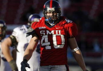 DALLAS - NOVEMBER 29:  Defensive end Justin Rogers #40 of the Southern Methodist University Mustangs on the field during the game against the Texas Christian University Horned Frogs on November 29, 2003 at Gerald J. Ford Stadium in Dallas, Texas. TCU won 20-13.  (Photo by Brian Bahr/Getty Images)