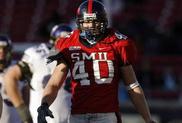 DALLAS - NOVEMBER 29:  Defensive end Justin Rogers #40 of the Southern Methodist University Mustangs on the field during the game against the Texas Christian University Horned Frogs on November 29, 2003 at Gerald J. Ford Stadium in Dallas, Texas. TCU won 20-13.  (Photo by Brian Bahr/Getty Images)