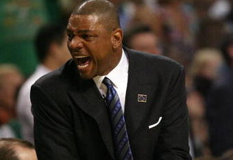 BOSTON - MAY 12:  Head coach Doc Rivers of the Boston Celtics celebrates the win over the Orlando Magic in Game Five of the Eastern Conference Semifinals during the 2009 NBA Playoffs at TD Banknorth Garden May 12, 2009 in Boston, Massachusetts. The Celtics defeated the Magic 92-88.  NOTE TO USER: User expressly acknowledges and agrees that, by downloading and or using this photograph, User is consenting to the terms and conditions of the Getty Images License Agreement.  (Photo by Elsa/Getty Images)