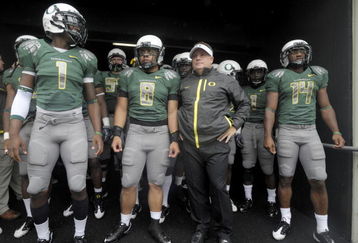 EUGENE, OR - SEPTEMBER 19: Darron Thomas #1, Jeremiah Masoli #8, head coach Chip Kelly and Javes Lewis #14 of the Oregon Ducks wait in the tunnel to be introduced before the start of the game against the Utah Utes at Autzen Stadium on September 19, 2009 in Eugene, Oregon. Oregon won the game 31-24. (Photo by Steve Dykes/Getty Images)