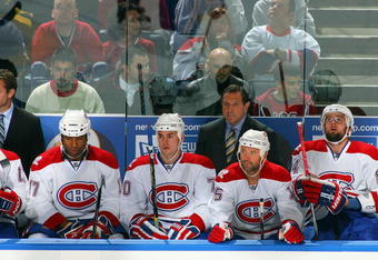 BUFFALO, NY - OCTOBER 3:  (L-R) Assistant Coach Kirk Mueller and Head Coach Jacques Martin of the Montreal Canadiens look on from behind the bench during their NHL game against the Buffalo Sabres at HSBC Arena on October 3, 2009 in Buffalo, New York. The Canadiens defeated the Sabres 2-1 in overtime. (Photo by Rick Stewart/Getty Images)