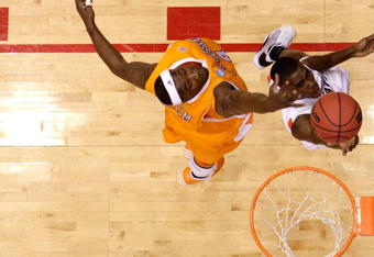 DAYTON, OH - MARCH 20: Terrel Harris #1 of the Oklahoma State Cowboys Wayne Chism #4 of the Tennessee Volunteers during the first round of the NCAA Division I Men's Basketball Tournament at the University of Dayton Arena on March 20, 2009 in Dayton, Ohio.  (Photo by Andy Lyons/Getty Images)