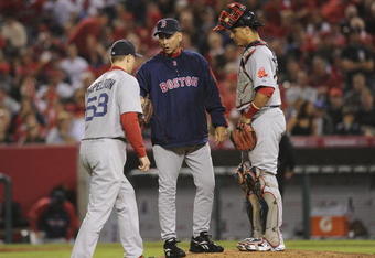 ANAHEIM, CA - OCTOBER 09:  Pitcher Jonathan Papelbon #58 of the Boston Red Sox receives the ball from manager Terry Francona #47 in the eighth inning of Game Two of the ALDS against the Los Angeles Angels of Anaheimduring the 2009 MLB Playoffs at Angel Stadium on October 9, 2009 in Anaheim, California.  (Photo by Lisa Blumenfeld/Getty Images)