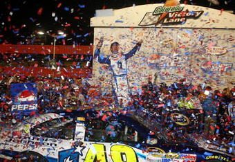 FONTANA, CA - AUGUST 31:  Jimmie Johnson, driver of the #48 Lowe's/Jimmie Johnson Foundation Chevrolet, celebrates in victory lane after winning the NASCAR Sprint Cup Series Pepsi 500 at Auto Club Speedway on August 31, 2008 in Fontana, California.  (Photo by Jonathan Moore/Getty Images for NASCAR)