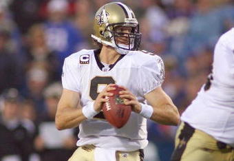ORCHARD PARK, NY - SEPTEMBER 27:  Quarterback Drew Brees #9 of the New Orleans Saints moves to pass the ball during the game against the Buffalo Bills at Ralph Wilson Stadium on September 27, 2009 in Orchard Park, New York. The Saints won 27-7. (Photo by Rick Stewart/Getty Images)