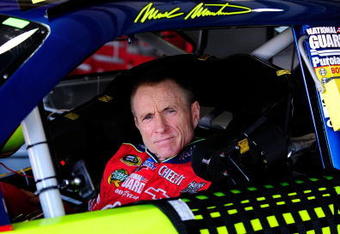 FONTANA, CA - OCTOBER 10:  Mark Martin, driver of the #5 Kellogg's/CARQUEST Chevrolet, waits in his car during practice for the NASCAR Sprint Cup Series Pepsi 500 at Auto Club Speedway on October 10, 2009 in Fontana, California.  (Photo by Rusty Jarrett/Getty Images for NASCAR)