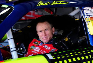 FONTANA, CA - OCTOBER 10:  Mark Martin, driver of the #5 Kellogg's/CARQUEST Chevrolet, waits in his car during practice for the NASCAR Sprint Cup Series Pepsi 500 at Auto Club Speedway on October 10, 2009 in Fontana, California.  (Photo by Rusty Jarrett/Getty Images for NASCAR)