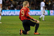 BLOEMFONTEIN, SOUTH AFRICA - JUNE 24: Fernando Torres of Spain kneels dejected during the FIFA Confederations Cup Semi Final match between Spain and USA at Free State Stadium on June 24, 2009 in Bloemfontein, South Africa. USA won the match 2-0. (Photo by Jasper Juinen/Getty Images)