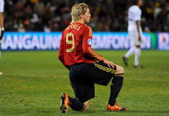 BLOEMFONTEIN, SOUTH AFRICA - JUNE 24:  Fernando Torres of Spain kneels dejected during the FIFA Confederations Cup Semi Final match between Spain and USA at Free State Stadium on June 24, 2009 in Bloemfontein, South Africa. USA won the match 2-0.  (Photo by Jasper Juinen/Getty Images)