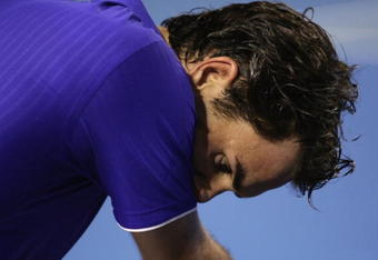 MELBOURNE, AUSTRALIA - FEBRUARY 01:  Roger Federer of Switzerland sits in his chair after the men's final match against Rafael Nadal of Spain during day fourteen of the 2009 Australian Open at Melbourne Park on  February 1, 2009 in Melbourne, Australia.  (Photo by Lucas Dawson/Getty Images)