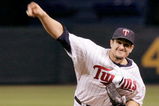 MINNEAPOLIS, MN - OCTOBER 4: Pitcher Carl Pavano #48 of the Minnesota Twins throws against the Kansas City Royals during their last game at Hubert H. Humphrey Metrodome on October 4, 2009 in Minneapolis, Minnesota. (Photo by Genevieve Ross/Getty Images)