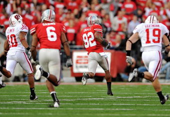 COLUMBUS, OH - OCTOBER 10:  Ray Small #82 of the Ohio State Buckeyes returns a kickoff 96-yards for a touchdown in the second half against the Wisconsin Badgers at Ohio Stadium on October 10, 2009 in Columbus, Ohio. Ohio State defeated Wisconsin 31-13.  (Photo by Jamie Sabau/Getty Images)