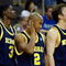 KANSAS CITY, MO - MARCH 21:  Manny Harris #3, C.J. Lee #2 and Zack Novak #0 of the Michigan Wolverines look on from the bench area en route to a 73-63 loss to the Oklahoma Sooners during the second round of the NCAA Division I Men's Basketball Tournament at the Sprint Center on March 21, 2009 in Kansas City, Missouri. The Sooners defeated the Wolverines 73-63.  (Photo by Jamie Squire/Getty Images)
