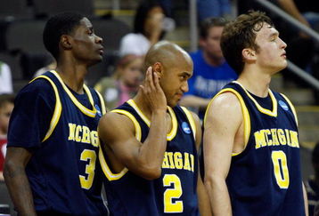 KANSAS CITY, MO - MARCH 21:  Manny Harris #3, C.J. Lee #2 and Zack Novak #0 of the Michigan Wolverines look on from the bench area en route to a 73-63 loss to the Oklahoma Sooners during the second round of the NCAA Division I Men's Basketball Tournament at the Sprint Center on March 21, 2009 in Kansas City, Missouri. The Sooners defeated the Wolverines 73-63.  (Photo by Jamie Squire/Getty Images)