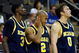KANSAS CITY, MO - MARCH 21:  Manny Harris #3, C.J. Lee #2 and Zack Novak #0 of the Michigan Wolverines look on from the bench area en route to a 73-63 loss to the Oklahoma Sooners during the second round of the NCAA Division I Men's Basketball Tournament at the Sprint Center on March 21, 2009 in Kansas City, Missouri. The Sooners defeated the Wolverines 73-63.  (Photo by Jamie Squire/Getty Images)