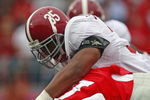 OXFORD, MS - OCTOBER 10:  Nico Johnson #35 of the Alabama Crimson Tide throws down Jesse Grandy #10 of the Mississippi Rebels during their college football game at Vaught-Hemingway Stadium on October 10, 2009 in Oxford, Mississippi. (Photo by Dave Martin/Getty Images)