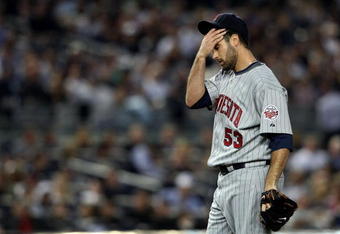 NEW YORK - OCTOBER 09:  Nick Blackburn #53 of the Minnesota Twins wipes his face while playing against the New York Yankees in Game Two of the ALDS during the 2009 MLB Playoffs at Yankee Stadium on October 9, 2009 in the Bronx borough of New York City.  (Photo by Nick Laham/Getty Images)