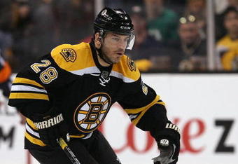 BOSTON - APRIL 16:  Mark Recchi #28 of the Boston Bruins skates up ice against the Montreal Canadiens during Game 1 of the Eastern Conference quarterfinals of the 2009 Stanley Cup playoffs on April 16, 2009 at the TD Banknorth Garden in Boston, Massachusetts. The Bruins defeated the Canadiens 4-2.  (Photo by Elsa/Getty Images)