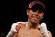 LAS VEGAS - DECEMBER 06: (L-R) Juan Manuel Lopez of Puerto Rico celebrates his first round knockout of Sergio Medina of Argentina during their WBO junior featherweight title fight at the MGM Grand Garden Arena December 6, 2008 in Las Vegas, Nevada. (Photo by Jed Jacobsohn/Getty Images)
