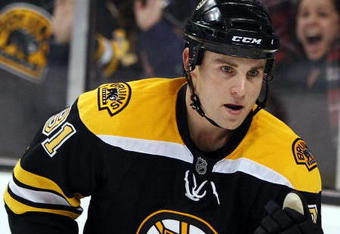 BOSTON - OCTOBER 10:  Marc Savard #91 of the Boston Bruins celebrates his game winning goal in the overtime shootout against the New York Islanders on October 10, 2009 at the TD Garden in Boston, Massachusetts. The Bruins defeated the Islanders 4-3 in an overtime shootout.  (Photo by Elsa/Getty Images)