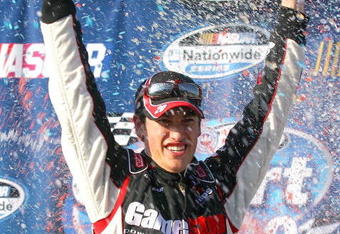 FONTANA, CA - OCTOBER 10:  Joey Logano, driver of the #20 GameStop/Brutal Legend Toyota, celebrates winning the NASCAR Nationwide Series Copart 300 at Auto Club Speedway on October 10, 2009 in Fontana, California.  (Photo by Jason Smith/Getty Images for NASCAR)