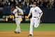 NEW YORK - OCTOBER 09:  Mark Teixeira #25 of the New York Yankees celebrates as he runs past Nick Punto #8 after hitting a walk off home run in the eleventh inning against the Minnesota Twins in Game Two of the ALDS during the 2009 MLB Playoffs at Yankee Stadium on October 9, 2009 in the Bronx borough of New York City.  (Photo by Jim McIsaac/Getty Images)