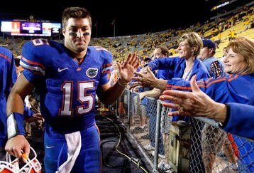 BATON ROUGE, LA - OCTOBER 10:  Quarterback Tim Tebow #15 of the Florida Gators celebrates their 13-3 win over the Louisiana State University Tigers with fans at Tiger Stadium on October 10, 2009 in Baton Rouge, Louisiana.  (Photo by Kevin C. Cox/Getty Images)